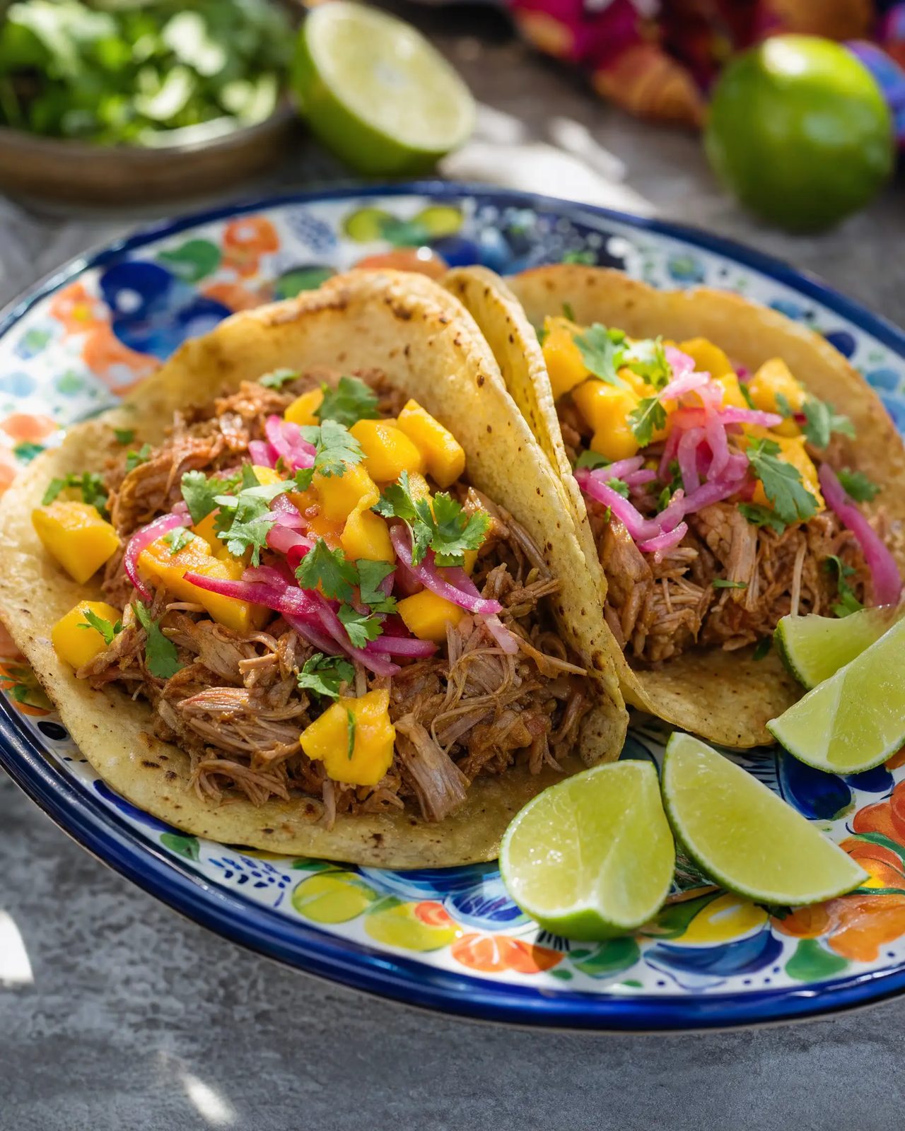Row of plant-based tacos topped with fresh salsa and herbs